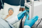 bigstock-Oncologist-Turning-On-Device-I-354790871 bigstock-Oncologist-Turning-On-Device-I-354790871